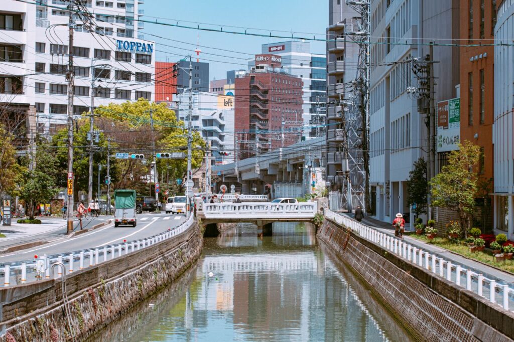 Explore urban landscapes with canals and modern architecture reflecting city life.